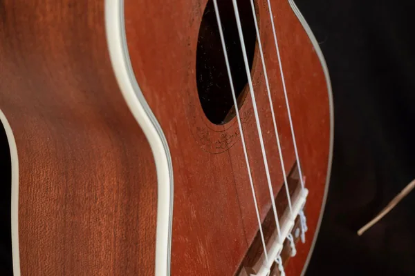 Virtual ukulele — wooden soprano ukulele fretboard close-up